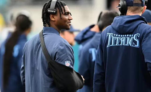 Tennessee Titans quarterback Cam Ward stands on the sideline during the second half of an NFL football game against the Jacksonville Jaguars, Sunday, Jan. 4, 2026, in Jacksonville, Fla. (AP Photo/Phelan M. Ebenhack)