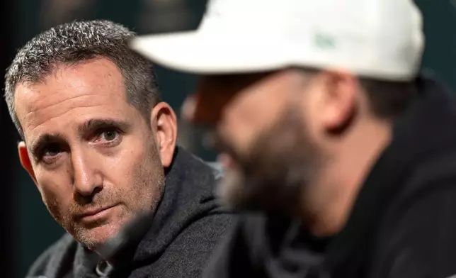Philadelphia Eagles executive vice president and general manager Howie Roseman, left, looks over as head coach Nick Sirianni, right, speaks with the media during a news conference at the NFL football team's training facility, Thursday, Jan. 15, 2026, in Philadelphia. (AP Photo/Chris Szagola)