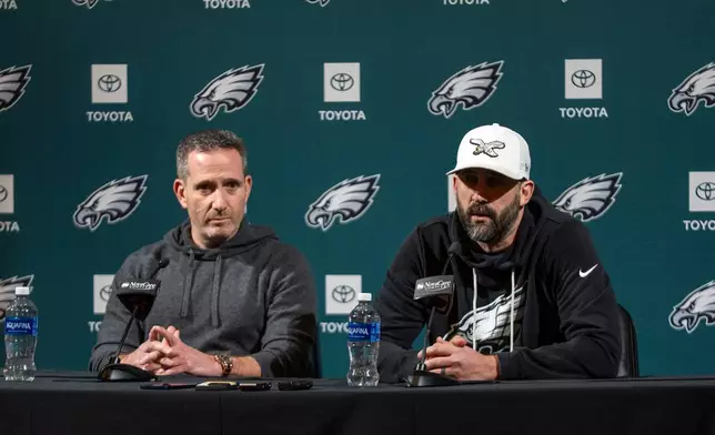 Philadelphia Eagles head coach Nick Sirianni, right, and executive vice president and general manager Howie Roseman, left, speaks with the media during a news conference at the NFL football team's training facility, Thursday, Jan. 15, 2026, in Philadelphia. (AP Photo/Chris Szagola)