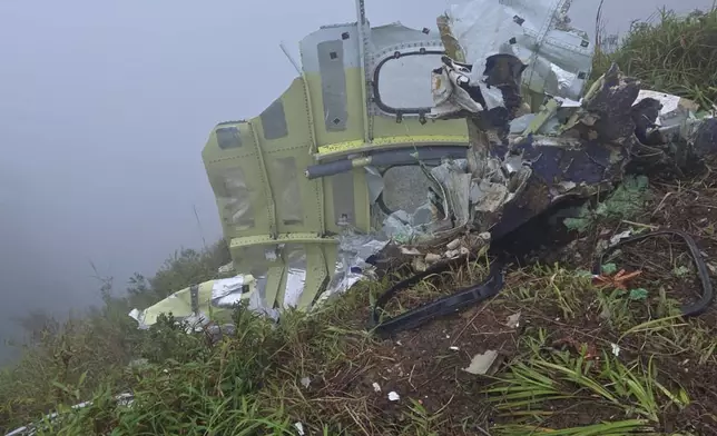 This photo provided by the Indonesian National Search and Rescue Agency (BASARNAS) shows debris of an ATR 42-500 turboprop airplane at Mount Bulusaraung in South Sulawesi province, Indonesia, Sunday, Jan. 18, 2026, after the aircraft lost contact Saturday. (BASARNAS via AP)
