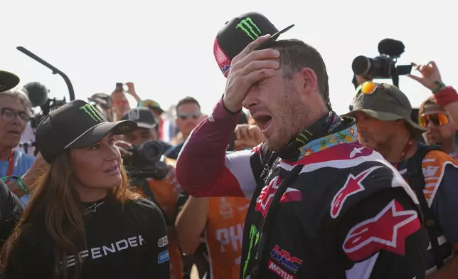 Rider Ricky Brabec of the U.S. reacts after the thirteenth stage with a start and finish in Yanbu, Saudi Arabia, Saturday, Jan.17, 2026. (AP Photo/Thibault Camus)