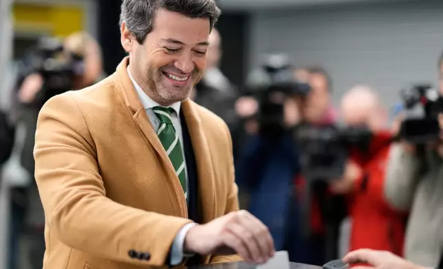 Presidential candidate Andre Ventura, of the populist Chega party, casts his ballot in Portugal's presidential election at a polling station in Lisbon, Sunday, Jan. 18, 2026. (AP Photo/Armando Franca)