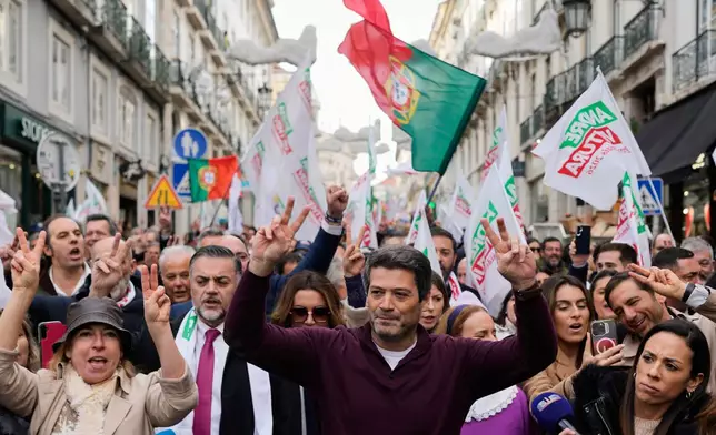 Presidential candidate Andre Ventura, of the populist Chega party, gestures to supporters while campaigning for Sunday's presidential election, in Lisbon, Friday, Jan. 16, 2026. (AP Photo/Armando Franca)