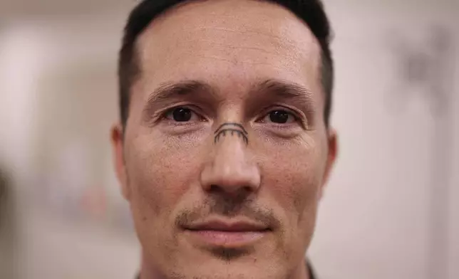 Juno Berthelsen, MP for the Naleraq opposition party that campaigns for independence in the Greenlandic parliament poses for photo at his office in Nuuk, Greenland, Thursday, Jan. 15, 2026. (AP Photo/Evgeniy Maloletka)