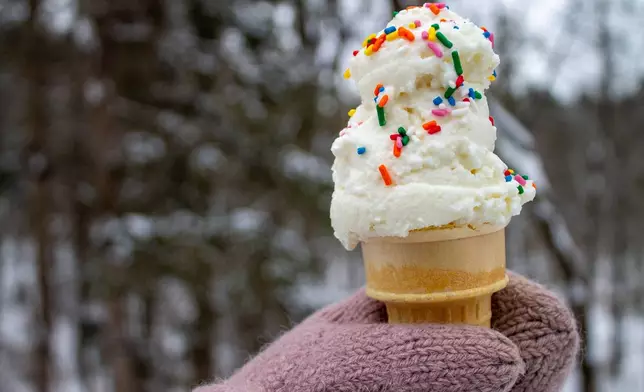 A cone of snow cream, made by mixing sweetened condensed milk with fresh snow, is seen Tuesday, Jan. 27, 2026, in Bow, N.H. (AP Photo/Holly Ramer)