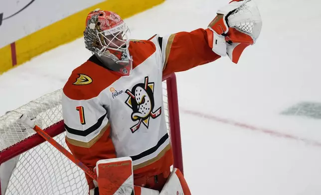 Anaheim Ducks goaltender Lukas Dostal celebrates after a shootout victory over the Colorado Avalanche in an NHL hockey game Wednesday, Jan. 21, 2026, in Denver. (AP Photo/David Zalubowski)