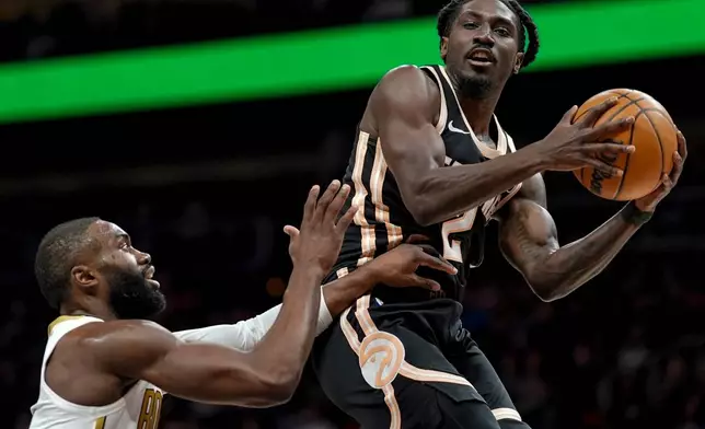 Atlanta Hawks guard Keaton Wallace (2) shoots against the Boston Celtics during the first half of an NBA basketball game, Saturday, Jan. 17, 2026, in Atlanta. (AP Photo/Mike Stewart)