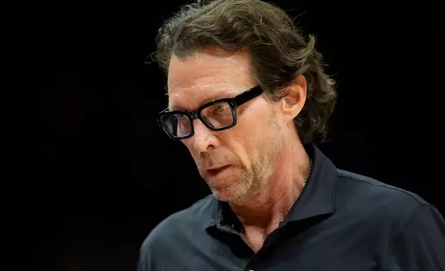 Atlanta Hawks head coach Quin Snyder walks the line during the first half of an NBA basketball game against the Boston Celtics, Saturday, Jan. 17, 2026, in Atlanta. (AP Photo/Mike Stewart)
