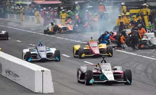 FILE - Drivers participate in the Indianapolis 500 auto race at Indianapolis Motor Speedway in Indianapolis, May 25, 2025. (AP Photo/AJ Mast, File)