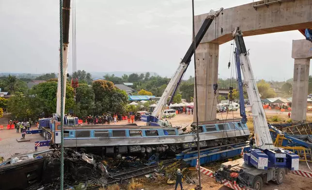 The scene after a construction crane fell into a passenger train in Nakhon Ratchasima province, Thailand, Wednesday, Jan.14, 2026. (AP Photo/Sakchai Lalit))