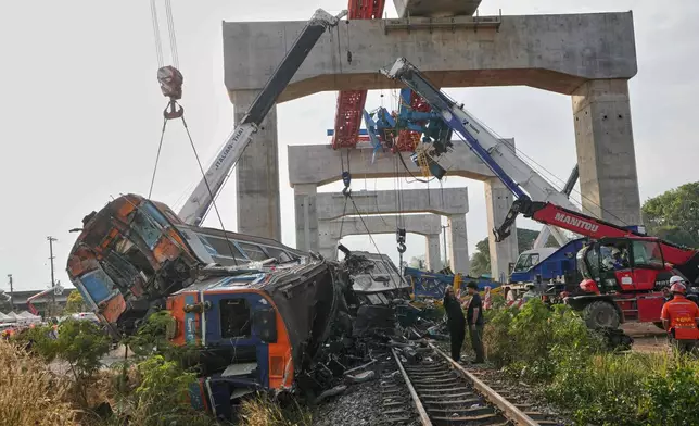 The wreckage after a construction crane fell into a passenger train in Nakhon Ratchasima province, Thailand, Wednesday, Jan.14, 2026. (AP Photo/Sakchai Lalit))