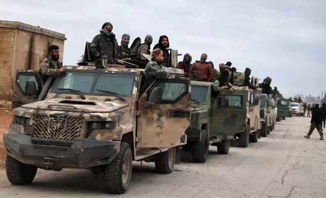 Syrian government forces enter the town of Deir Hafer, Saturday, Jan. 17, 2026, following the withdrawal of the U.S.-backed Syrian Democratic Forces. (AP Photo/Omar Albam)