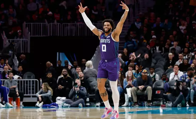 Charlotte Hornets forward Miles Bridges reacts during the first half of an NBA basketball game against the Philadelphia 76ers in Charlotte, N.C., Monday, Jan. 26, 2026. (AP Photo/Nell Redmond)