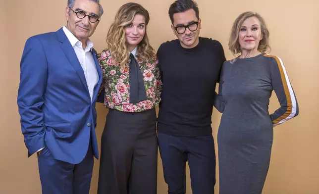 FILE - Eugene Levy, from left, Annie Murphy, Daniel Levy and Catherine O'Hara cast members in the series "Schitt's Creek" pose for a portrait during the 2018 Television Critics Association Winter Press Tour in Pasadena, Calif., on Jan. 14, 2018. (Photo by Willy Sanjuan/Invision/AP, File)