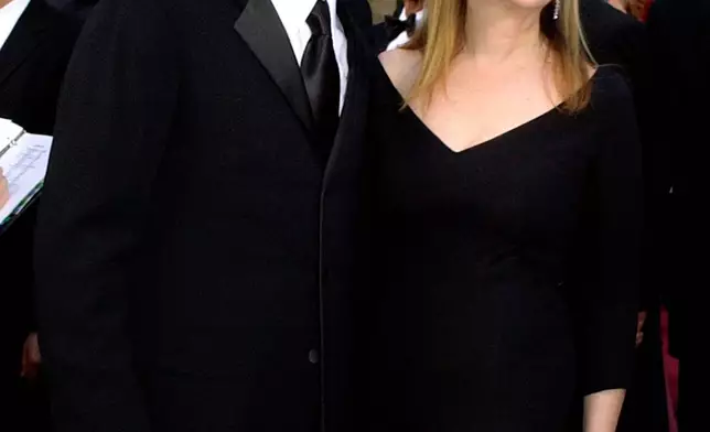 FILE - Eugene Levy, left, and Catherine O'Hara appear at the 76th annual Academy Awards in Los Angeles. on Feb. 29, 2004. (AP Photo/Laura Rauch, File)