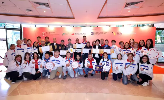 Jackson Woo, Steward of The Hong Kong Jockey Club (back row, 12th left), and Freely Cheng, the Club’s Head of External Affairs (back row, centre), with members of the Club’s CARE@hkjc Volunteer Team and the awarded JC VOLUNTEER TOGETHER volunteers.