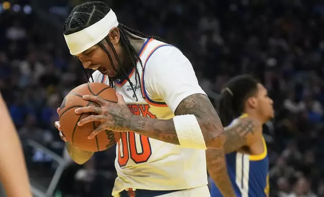 New York Knicks guard Jordan Clarkson reacts after scoring and drawing a foul during the first half of an NBA basketball game against the Golden State Warriors in San Francisco, Thursday, Jan. 15, 2026. (AP Photo/Jeff Chiu)