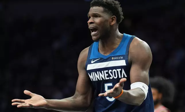 Minnesota Timberwolves guard Anthony Edwards reacts toward a referee during the first half of an NBA basketball game against the Chicago Bulls, Thursday, Jan. 22, 2026, in Minneapolis. (AP Photo/Abbie Parr)
