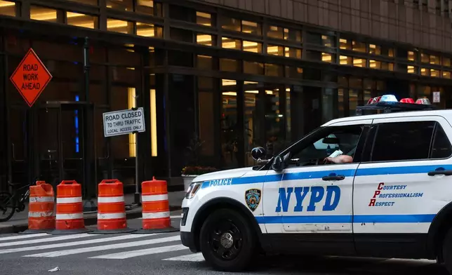 FILE - An NYPD cruiser sits at the intersection of a Midtown street closed due to construction, Nov. 7, 2024, in New York. (AP Photo/Heather Khalifa, File)