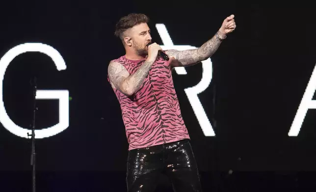 FILE - Singer Jordan McGraw performs on stage as an opening act for The Jonas Brothers "Happiness Begins" tour at the Capitol One Arena, Aug. 15, 2019, in Washington. (Photo by Brent N. Clarke/Invision/AP, File)