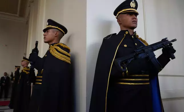 Presidential honor guards stand at the National Palace on the sidelines of a prayer breakfast hosted by President Nayib Bukele, attended by a couple U.S. lawmakers, in San Salvador, El Salvador, Monday, Jan. 19, 2026. (AP Photo/Salvador Melendez)