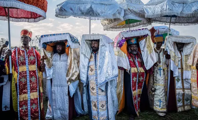 High priests celebrate Timket, the Ethiopian Epiphany, on the shore of lake Dembel, in Batu, Ethiopia, Sunday, Jan. 18, 2026. (AP Photo/Amanuel Sileshi)