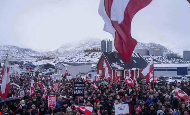 People protest against Trump's policy towards Greenland in front of the US consulate in Nuuk, Greenland, Saturday, Jan. 17, 2026. (AP Photo/Evgeniy Maloletka)