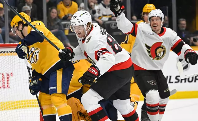 Ottawa Senators' Stephen Halliday (83) reacts along with center Nick Cousins, right, as Nashville Predators defenseman Nick Blankenburg, left, looks away during the first period of an NHL hockey game Thursday, Jan. 22, 2026, in Nashville, Tenn. (AP Photo/John Amis)