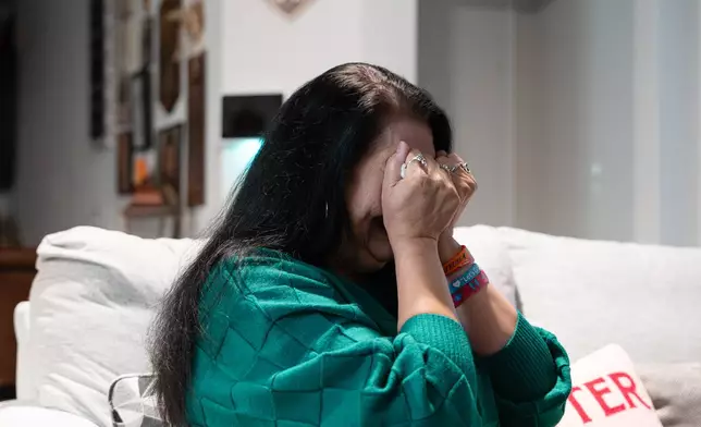 Velma Lisa Duran, sister of Robb Elementary teacher Irma Garcia, cries as she reflects on the 2022 Uvalde, Texas, school shooting during an interview on Dec. 19, 2025, in San Antonio. (AP Photo/Kin Man Hui)