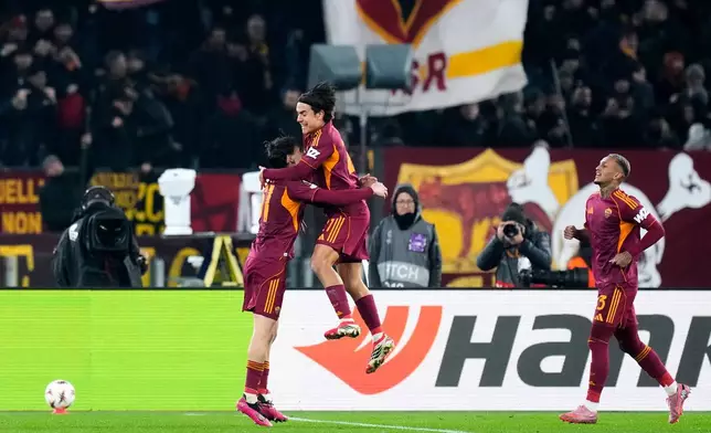 Roma's Niccolo Pisilli, center, celebrates after scoring his side's second goal during the Europa League soccer match between Roma and VfB Stuttgart in Rome, Thursday, Jan. 22, 2026. (AP Photo/Gregorio Borgia)
