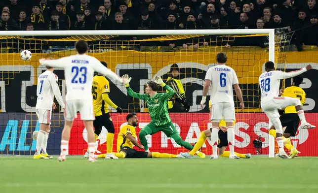 Lyon's Ainsley Maitland-Niles, second from right, scores the opening goal during the Europa League opening phase soccer match between Young Boys and Olympique Lyonnais, in Bern, Switzerland, Thursday, January 22, 2026. (Anthony Anex/Keystone via AP)