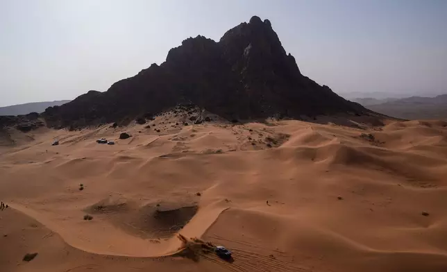 Driver Carlos Sainz and co-driver Lucas Cruz compete during the second stage of the Dakar Rally between Yanbu and Alula, Saudi Arabia, Monday, Jan. 5, 2026. (AP Photo/Thibault Camus)