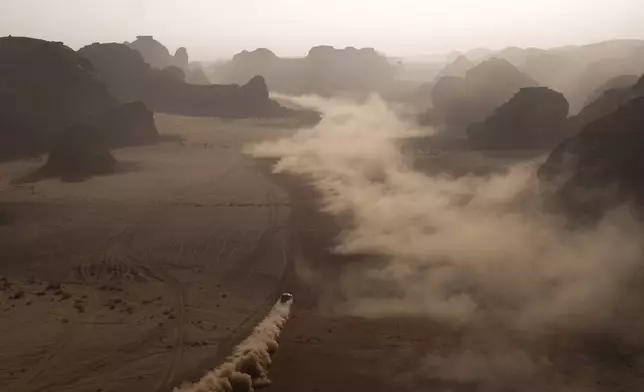 Driver Sebastien Loeb and co-driver Edouard Boulanger compete during the fourth stage of the Dakar Rally between Alula and Hail, Saudi Arabia, Wednesday, Jan. 7, 2026. (AP Photo/Thibault Camus)