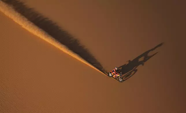 Rider Luciano Benavides competes during the ninth stage of the Dakar Rally between Wadi Ad Dawasir and Bisha, Saudi Arabia, Tuesday, Jan.13, 2026. (AP Photo/Thibault Camus)
