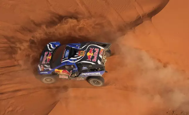 Driver Mattias Ekstrom and co-driver Emil Bergkvist compete during the second stage of the Dakar Rally between Yanbu and Alula, Saudi Arabia, Monday, Jan. 5, 2026. (AP Photo/Thibault Camus)
