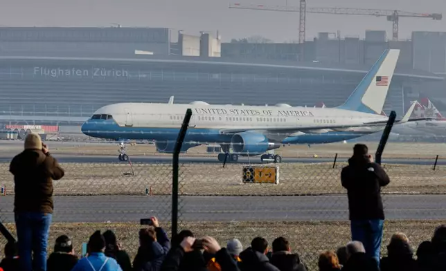 Air Force One lands at the airport in Zurich, Switzerland, Wednesday, Jan. 21, 2026. (AP Photo/Arnd Wiegmann)
