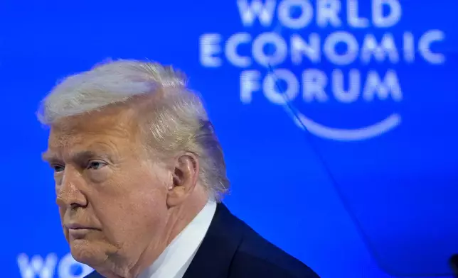 President Donald Trump enters the stage for his special address during the 56th annual meeting of the World Economic Forum, WEF, in Davos, Switzerland, Wednesday, Jan. 21, 2026. (Gian Ehrenzeller/Keystone via AP)