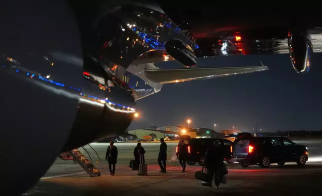 Things are unloaded from Air Force One after the plane, carrying President Donald Trump to the World Economic Form in Davos, experienced a minor electrical issue after departure, Tuesday, Jan. 20, 2026, and returned to Joint Base Andrews, Md. Trump will board a second plane to complete the trip. (AP Photo/Evan Vucci)