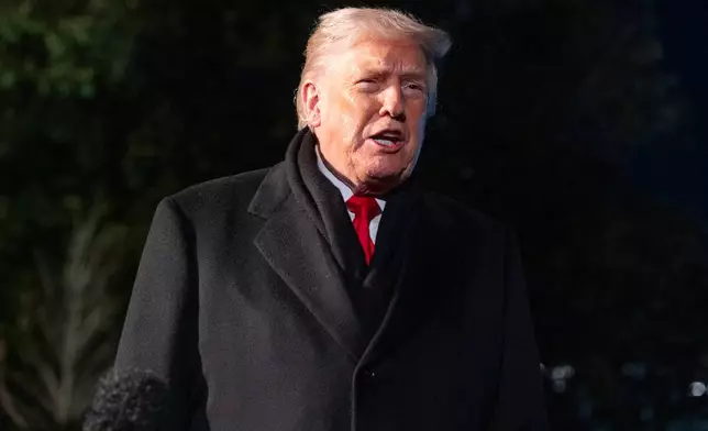 President Donald Trump speaks before departing on Marine One from the South Lawn of the White House, Tuesday, Jan. 20, 2026, in Washington. (AP Photo/Alex Brandon)