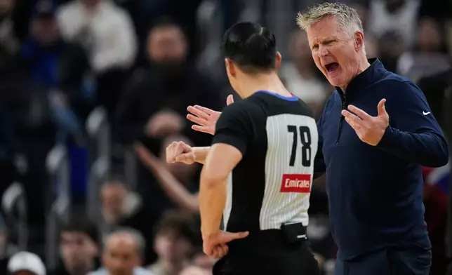 Golden State Warriors head coach Steve Kerr, right, reacts toward referee Evan Scott (78) during the first half of an NBA basketball game against the Oklahoma City Thunder, Friday, Jan. 2, 2026, in San Francisco. (AP Photo/Godofredo A. Vásquez)