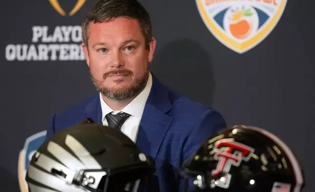 Oregon head coach Dan Lanning listens during a press conference ahead of an Orange Bowl College Football Playoff quarterfinal game against Texas Tech, Wednesday, Dec. 31, 2025, in Dania Beach, Fla. (AP Photo/Rebecca Blackwell)