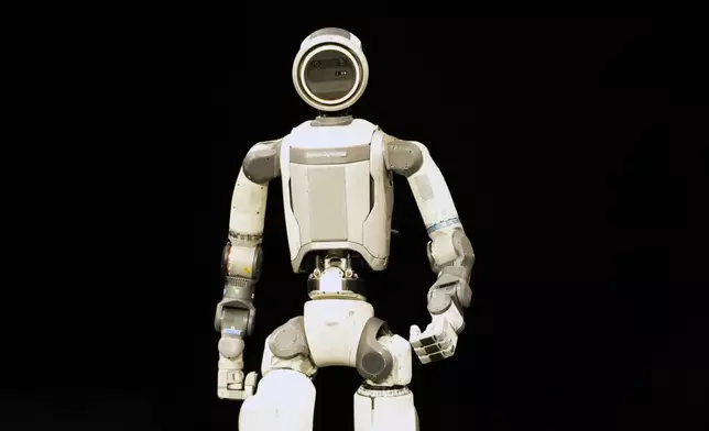 An Atlas robot stands on the stage during a Hyundai and Boston Dynamics news conference ahead of the CES tech show, Monday, Jan. 5, 2026, in Las Vegas. (AP Photo/Abbie Parr)