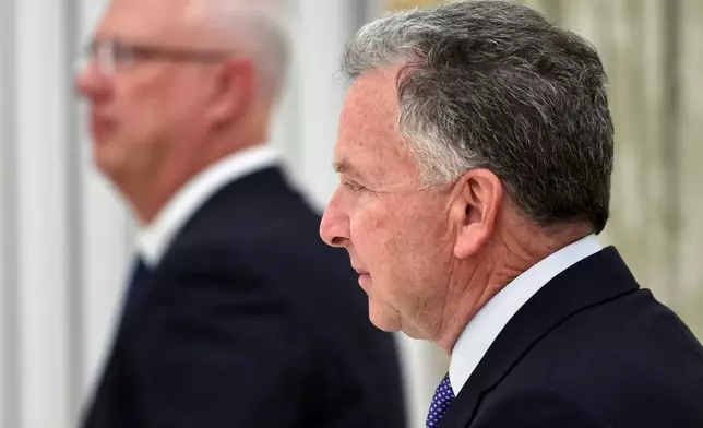 U.S. President Donald Trump's envoys Steve Witkoff, right, and Putin's envoy Kirill Dmitriev arrive to attend the talks with Russian President Vladimir Putin at the Senate Palace of the Kremlin, in Moscow, Thursday, Jan. 22, 2026. (Alexander Kazakov/Sputnik, Kremlin Pool Photo via AP)
