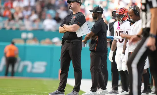 Cincinnati Bengals head coach Zac Taylor watches from the sidelines during an NFL football game against the Miami Dolphins, Sunday, Dec. 21, 2025, in Miami Gardens, Fla. (AP Photo/Lynne Sladky)