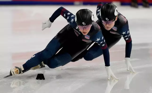 FILE - United States' Kristen Santos-Griswold, gold medal, leads Corinne Stoddard, silver medal, during the women's 1000 meters final of the ISU Short Track World Tour and Olympics Milano-Cortina 2026 test event, in Milan, Italy, Saturday, Feb. 15, 2025. (AP Photo/Luca Bruno, File)