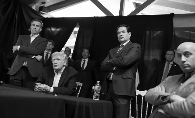 In this photo released by the White House, President Donald Trump monitors U.S. military operations in Venezuela, with CIA Director John Ratcliffe, left, Secretary of State Marco Rubio and White House deputy chief of staff Stephen Miller, right, at Mar-a-Lago in Palm Beach, Fla., Saturday, Jan. 3, 2026. (Molly Riley/The White House via AP)