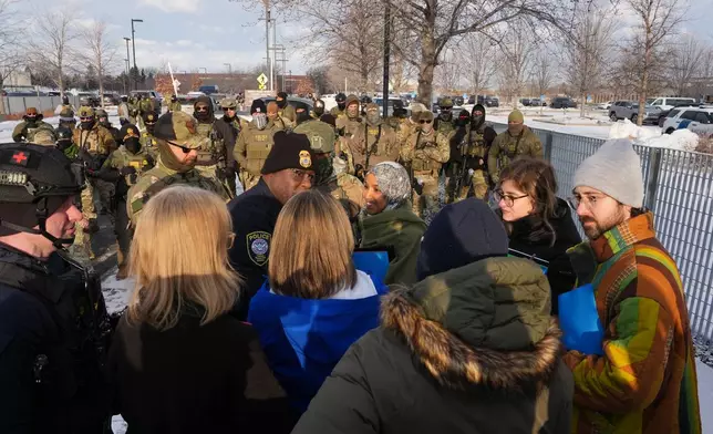 Protesters gather during a rally for Renee Good, who was fatally shot by an ICE officer earlier in the week, Saturday, Jan. 10, 2026, in Minneapolis. (AP Photo/Adam Gray)