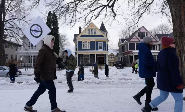 Protesters gather during a rally for Renee Good, who was fatally shot by an ICE officer earlier in the week, Friday, Jan. 10, 2026, in Minneapolis. (AP Photo/Jen Golbeck)
