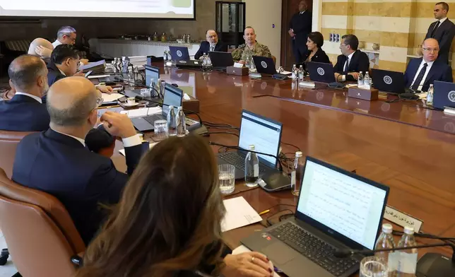 In this photo released by the Lebanese Presidency press office, Lebanese army chief Gen. Rudolph Haikal, second background left, speaks during a cabinet meeting at the presidential place in Baabda, east of Beirut, Lebanon, Thursday, Jan. 8, 2026. (Lebanese Presidency press office via AP)