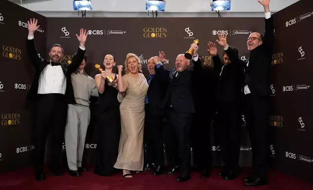 Philip Barantini, from left, Owen Cooper, Erin Doherty, Hannah Walters, Stephen Graham, Andy Cooper, Ashley Walters, Jeremy Kleiner, and Jack Thorne pose in the press room with the award for best television limited series, anthology series or motion picture made for television for "Adolescence" during the 83rd Golden Globes on Sunday, Jan. 11, 2026, at the Beverly Hilton in Beverly Hills, Calif. (AP Photo/Chris Pizzello)
